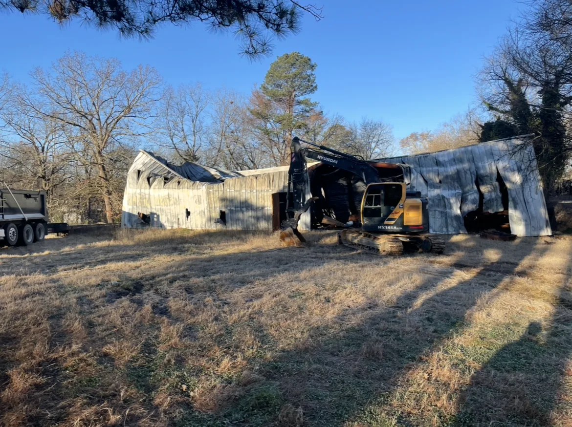 Residential structure coming down under control mid-demolition